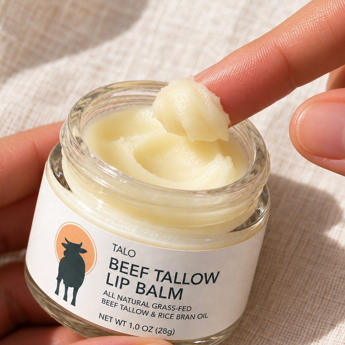 Scooping TALO balm with a fingertip
